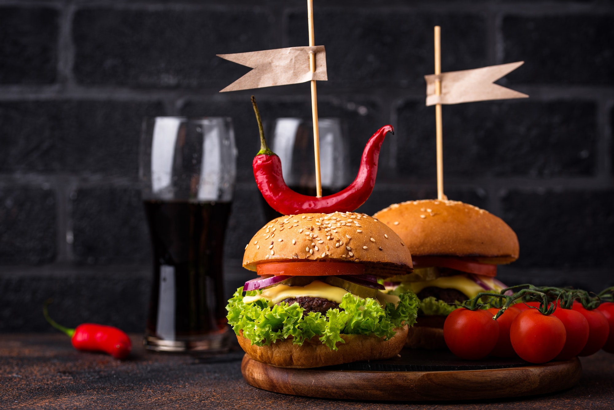 Burger and cheeseburger with tomato